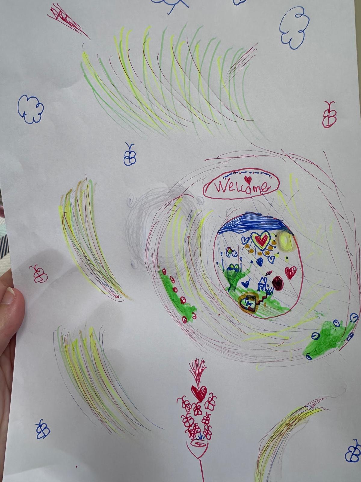 A listener's hand-drawn dream tunnel: a colourful spiral marked 'Welcome' leading to a house, trees, hearts and butterflies